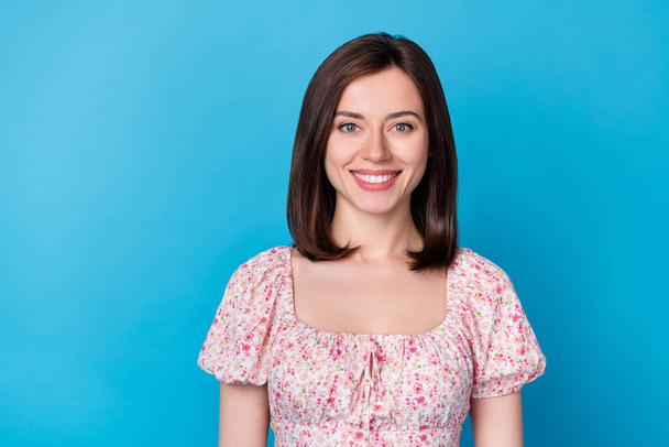 Closeup photo of young attractive gorgeous woman wear cute flowers top smiling looking you isolated on blue color background. - Foto, immagini