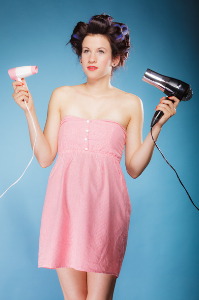 Girl  holding hairdreyers - Foto, Bild