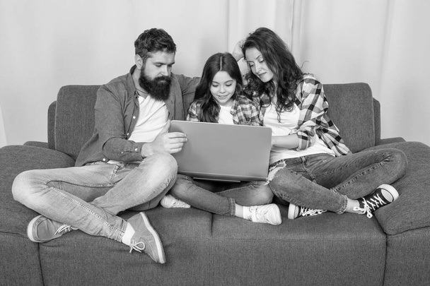 family blog. happy parents with kid girl study online. curious mom dad and daughter shopping on cyber monday. modern education and communication. video call. father mother and child use laptop. - Foto, immagini