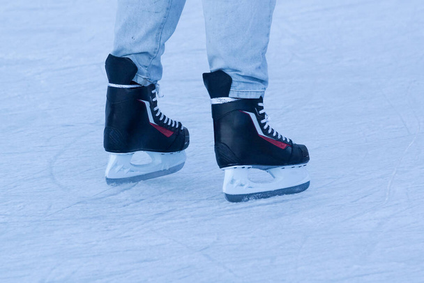 Low section of person ice skating on ice rink - Foto, Imagem