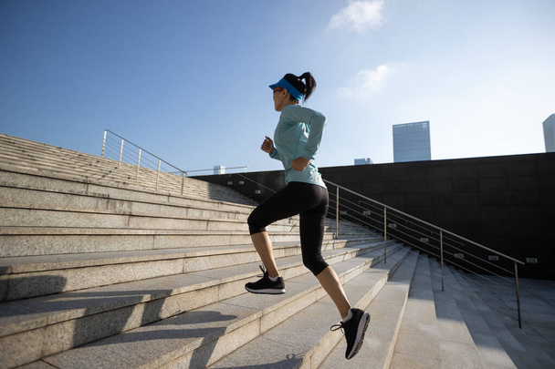 Fitness sports woman running up stairs in city - Foto, Bild
