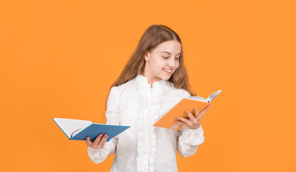 education in high school. schoolgirl with copybook. teen girl with notebook. back to school. kid ready to study. happy childhood. child going to do homework reading book. cheerful teenager student. - Фото, изображение