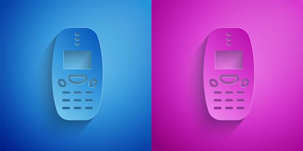 Paper cut Old vintage keypad mobile phone icon isolated on blue and purple background. Retro cellphone device. Vintage 90s mobile phone. Paper art style. Vector. - Вектор,изображение