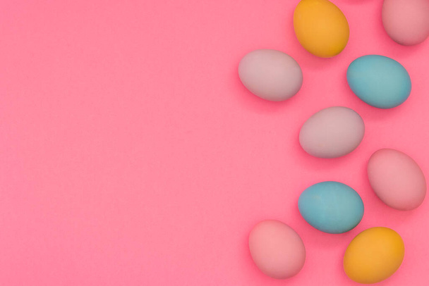 Easter eggs, pastel colors, top view. Flat lay, Easter background design - Fotó, kép
