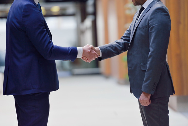 Young business people shaking hands - Fotó, kép