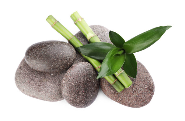 Spa stones and bamboo on white background, top view - Zdjęcie, obraz