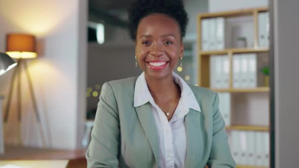 Night, smile and face of black woman in office for professional, corporate and management. Deadline, overtime and empowerment with employee at desk in agency for business, ceo and confidence. - Footage, Video