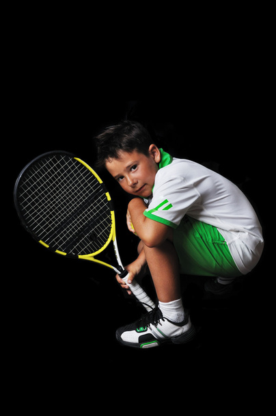 Tennis boy isolated in black - Photo, Image