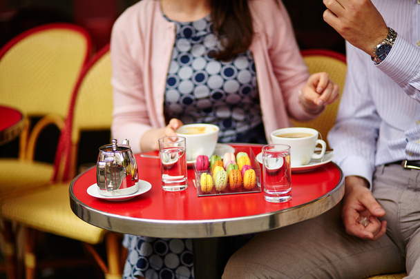 Coffee or tea and macaroons in a Parisian cafe - Φωτογραφία, εικόνα