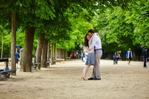 Couple hugging in the Luxembourg garden of Paris - Photo, Image