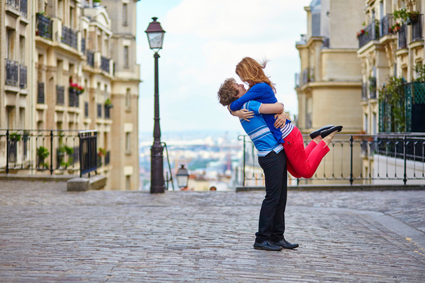 Young dating couple hugging on Montmartre - Fotó, kép