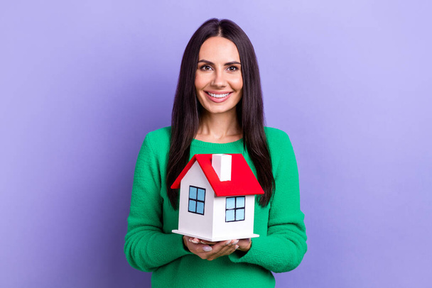 Photo of young positive smiling enjoy her life business lady hold first property owner buy new big house advert isolated on violet color background. - Fotó, kép