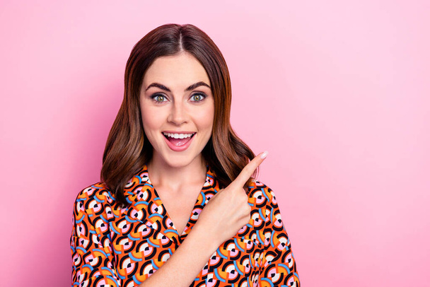 Portrait of astonished positive lady open mouth indicate finger empty space isolated on pink color background. - Valokuva, kuva