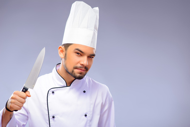 Portrait of young handsome cook - Foto, Bild