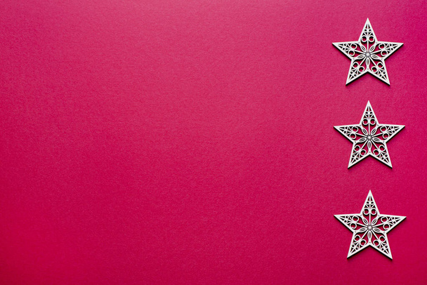 Red background photography of Christmas stars, blank, copy space - Photo, Image