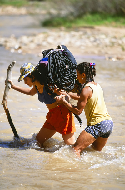 Rock climbing team crossing a river. - Photo, Image