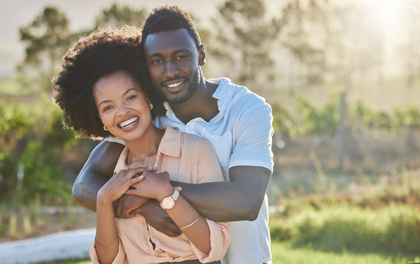 Couple, black people and hug in park portrait with smile, sunshine and happiness for romantic love. Young black man, black woman and bonding embrace on summer adventure, relax and outdoor in Atlanta. - Zdjęcie, obraz