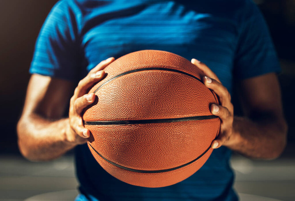 Hands, basketball and sports man ready for outdoor match game training with athletic grip closeup. Fitness, exercise and athlete male holding ball prepared to practice for competition macro - Photo, image