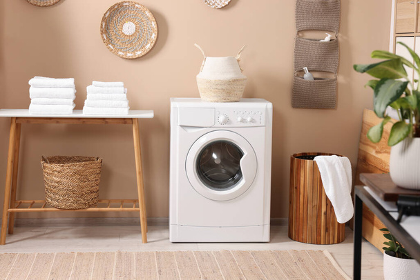 Stylish laundry room with modern washing machine. Interior design - Valokuva, kuva