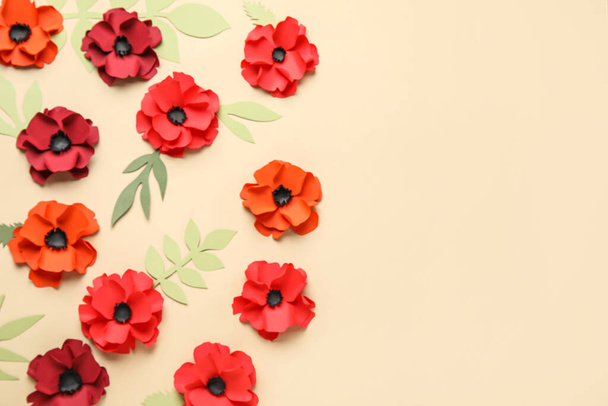 Paper poppy flowers with leaves on beige background - Photo, Image