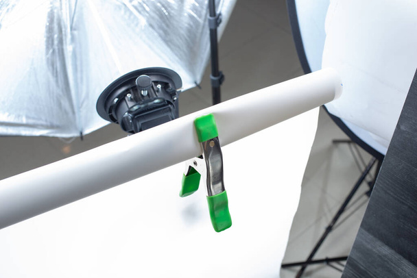 A view of a spring clamp in action, during a photo shoot production. - Photo, Image