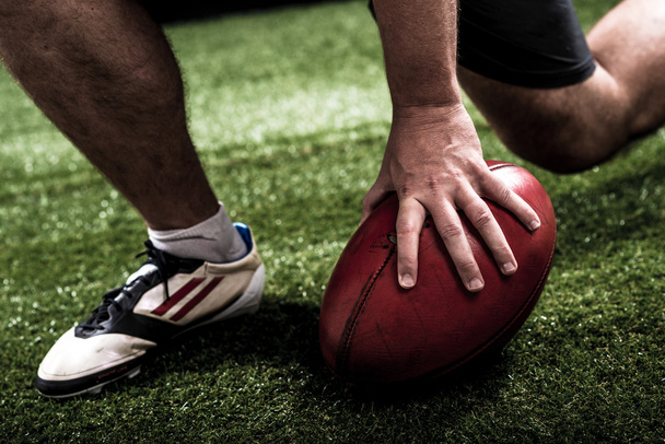 Jalkapalloilija tekee touchdownin
 - Valokuva, kuva