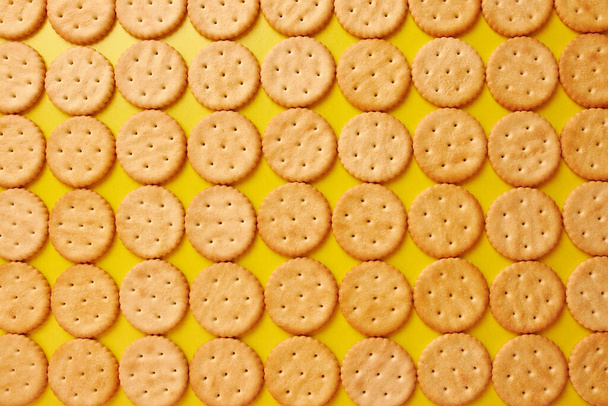 We lay out the background from round cookies. A tasty and sweet snack. - Photo, Image