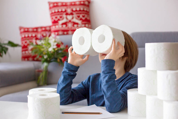 Child, playing with toilet paper ato home - Фото, изображение