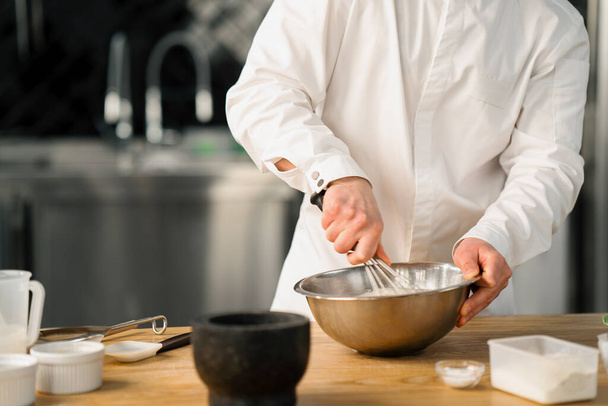 Professional kitchen chef prepares pancake - Fotoğraf, Görsel