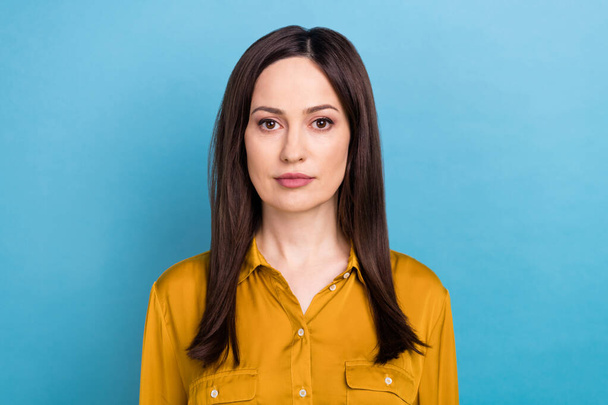 Portrait of young serious confident business lady wear orange shirt formal uniform professional manager entrepreneur isolated on blue color background. - Фото, изображение