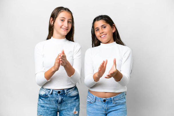 Friends girls over isolated white background applauding after presentation in a conference - 写真・画像