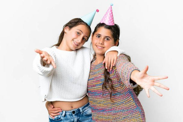 Friends girls in a party birthday over isolated white background - Fotografie, Obrázek