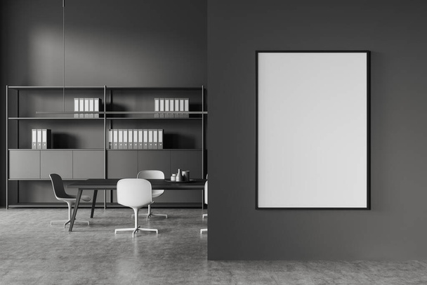 Dark office interior with meeting table, chairs and shelf with documents. Conference zone with modern furniture on grey concrete floor. Mock up canvas poster on partition. 3D rendering - Photo, image