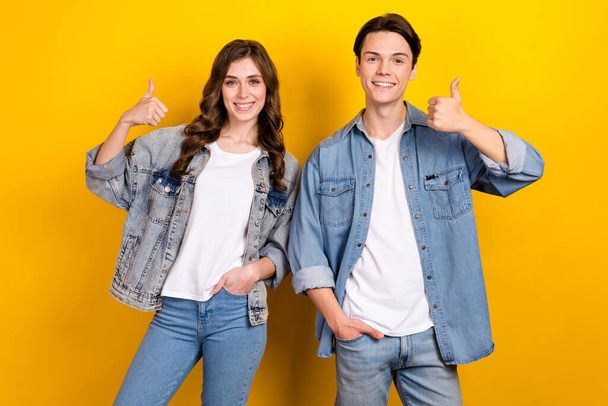 Photo of attractive girl handsome guy toothy smile demonstrate thumb up approval isolated on yellow color background. - Foto, immagini