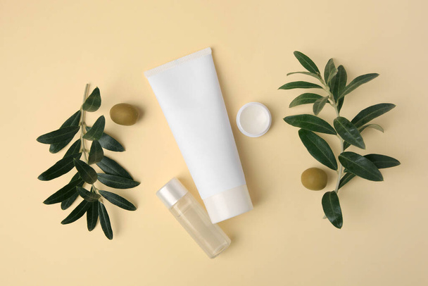Different cosmetic products and ingredient on beige background, flat lay - Foto, afbeelding