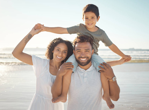Happy family, portrait and beach holiday with parents bonding with their son, playful ocean fun. Love, travel and family time with young man and woman enjoying a sea trip with their smiling son. - 写真・画像