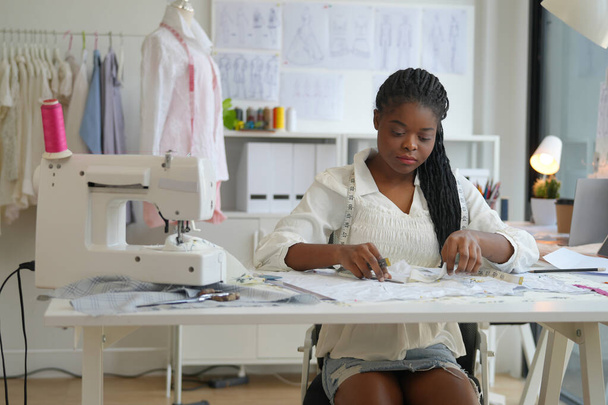 young clothes designer in her studio - Foto, Imagen