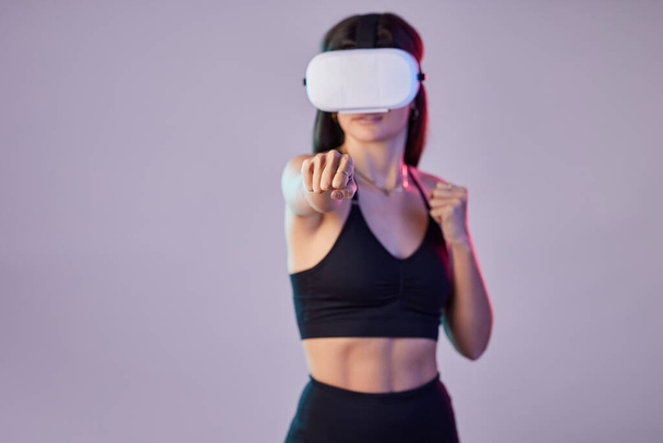 Fitness, vr or girl boxer in metaverse on studio background digital gaming on cyber sports with mock up. Woman, fist or virtual reality user fighting or gamer boxing in futuristic 3d ai experience. - Zdjęcie, obraz