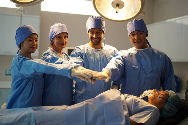 surgeons working inside operating room   - Foto, Bild