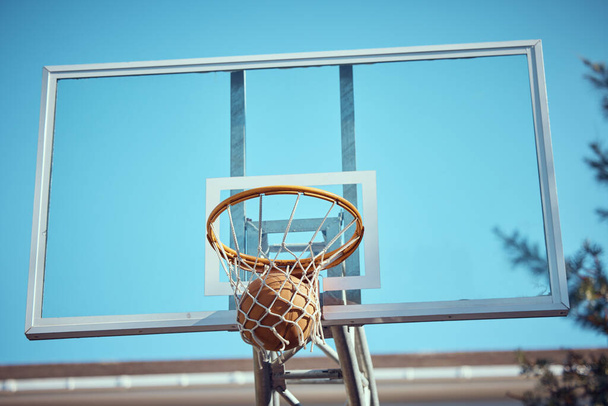 Basketball court net, point score and sports playing game, competition and action match outdoor. Background hoop winning, goal target aim and shooting hoops skills training, hobby and fun performance. - Photo, Image