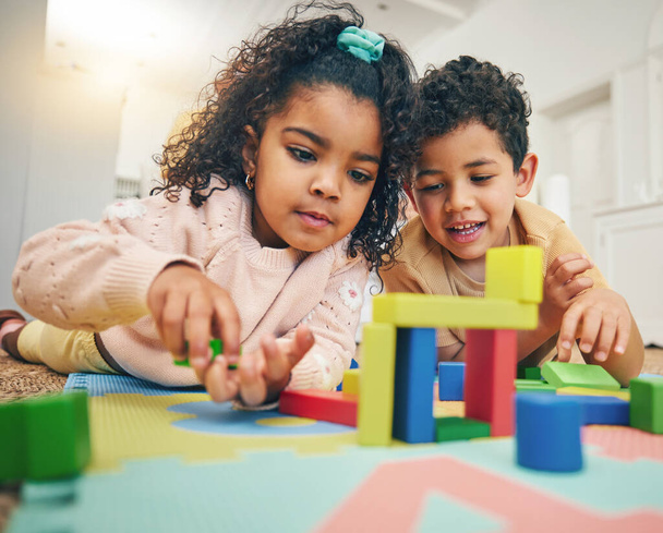 Building blocks, happy children and floor with toys for playing, bonding and educational games at home. Family, child development and boy and girl enjoy creative activity, learning and relaxing. - Fotoğraf, Görsel