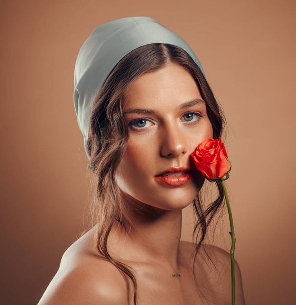 Rose, woman and face with natural beauty, skincare and luxury cosmetics of floral aesthetic, perfume or facial makeup on studio background. Headshot, portrait and model with roses, nature and flowers. - Fotoğraf, Görsel