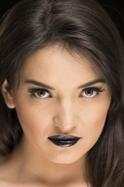beautiful young woman wearing goth makeup - Foto, afbeelding