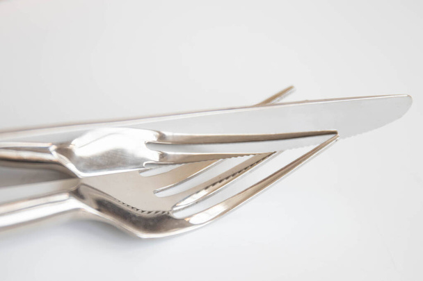 Knife and fork on a brown background. Selective focus. - Photo, Image