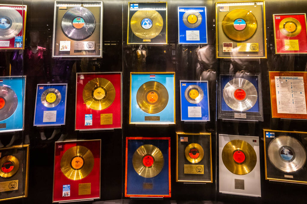 STOCKHOLM, SWEDEN - JUNE 16, 2022: hall with a collection of records at the ABBA museum in Stockholm, Sweden - Photo, Image