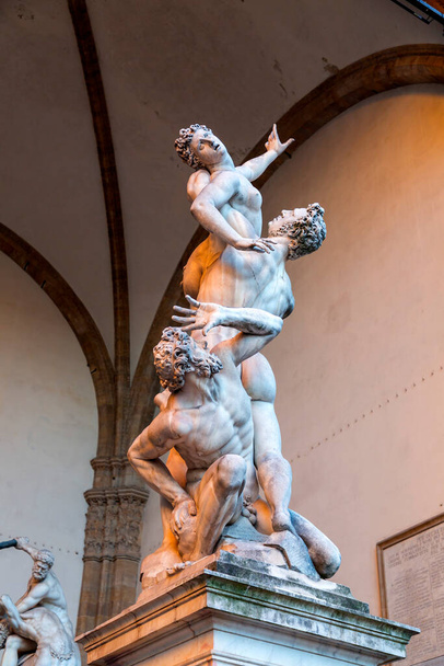 Florence, Italy - April 5, 2022: Sculptures at the Loggia dei Lanzi, a building on a corner of the Piazza della Signoria in Florence, Italy, adjoining the Uffizi Gallery. - Fotó, kép