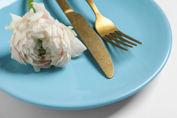 Stylish table setting with cutlery and flower on white background, closeup - Zdjęcie, obraz