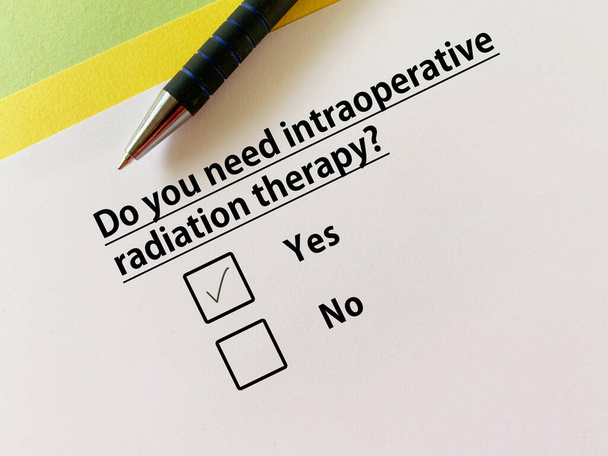 A person is answering question about bowel issues. He needs intraoperative radiation therapy. - Photo, Image