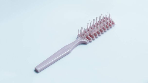 Woman stylish pink hair comb used for thick hair. - Fotó, kép