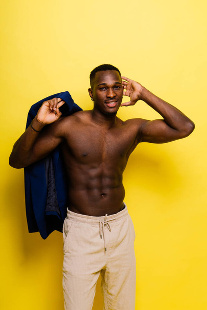 Young african man standing shirtless with happy and cool smile on face. lucky person. - Fotografie, Obrázek